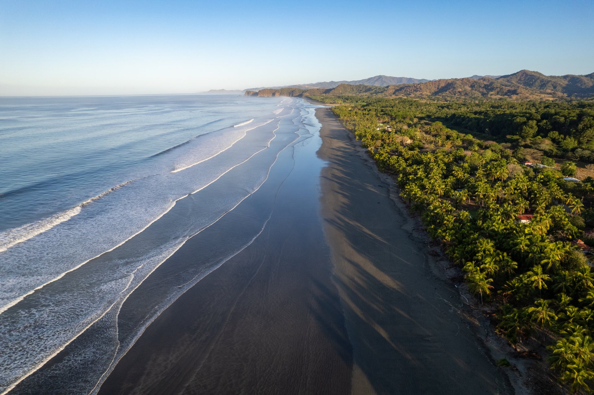Long aerial of Playa Coyote shoreline, Guanacaste Costa Rica