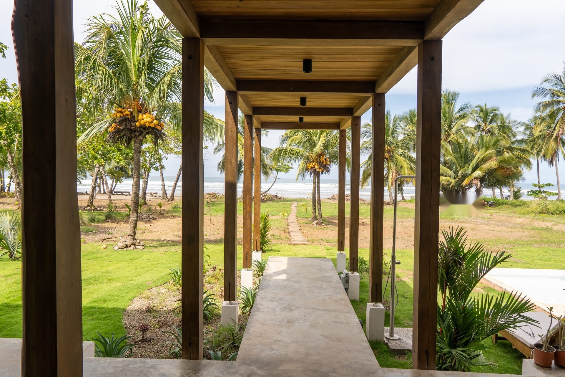 Covered hardwood walkway between rooms, Mar del Sol Guanacaste