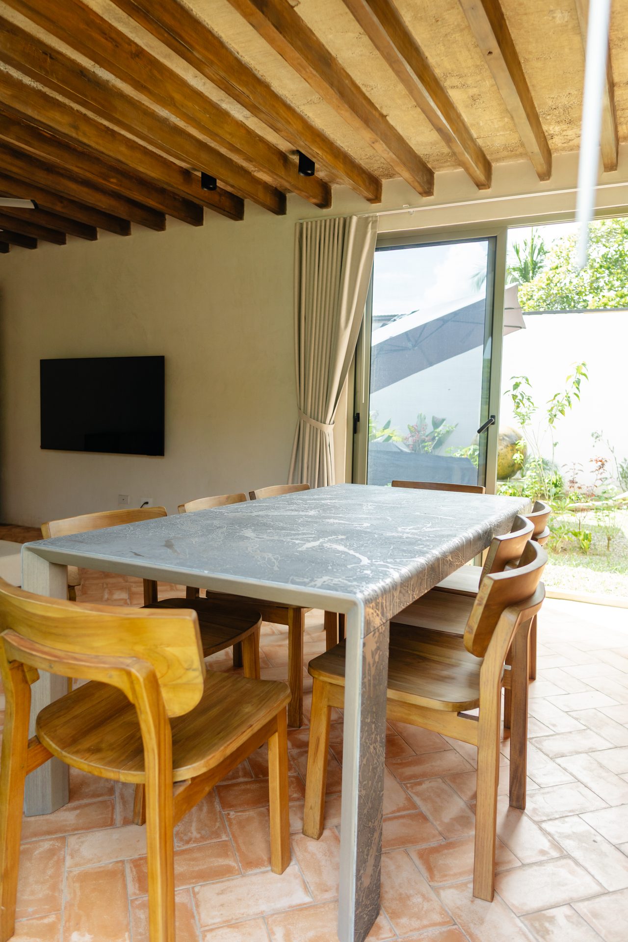 Fifth bedroom dining table opening to private garden, Mar del Sol